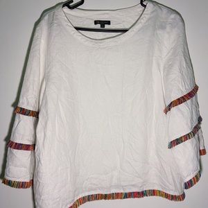 nwot white linen shirt with rainbow fringe around the sleeves and hem.